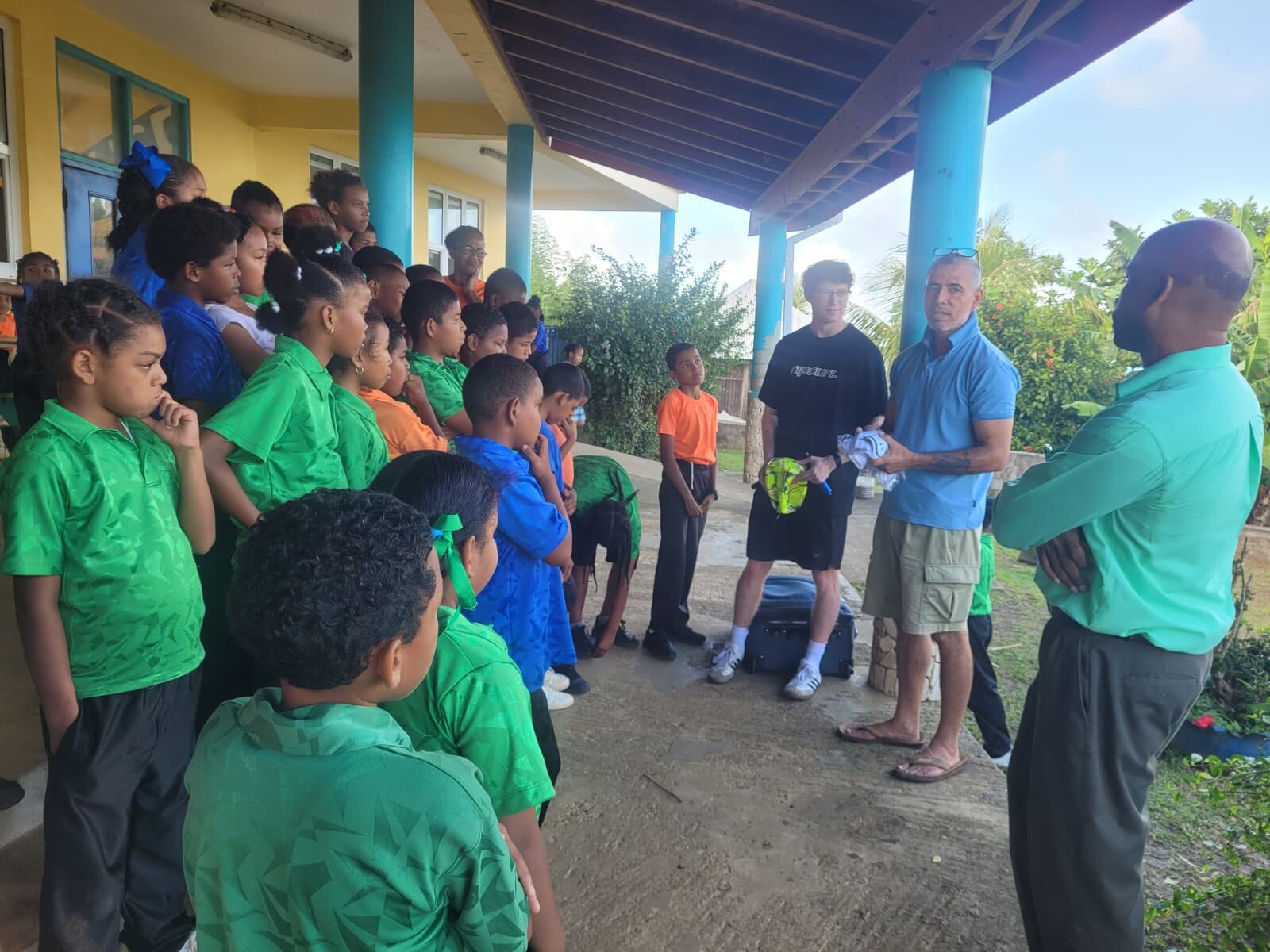 Delivering donated soccer gear to a Kalinago school, January 2026